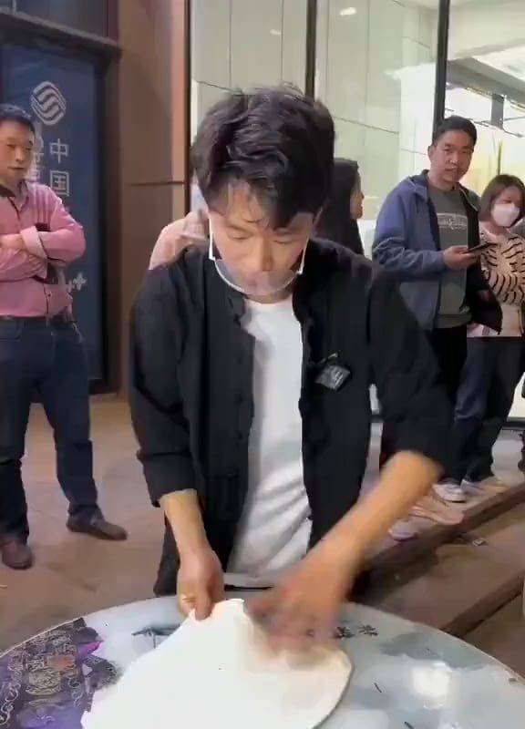 this cook is showing some serious acrobatic skills