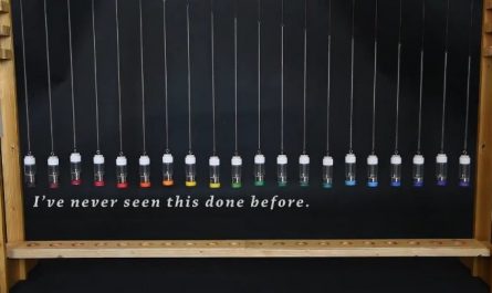 A mercury pendulum wave: 20 little bottles containing slightly different masses of mercury so the oscillating frequency is slightly different