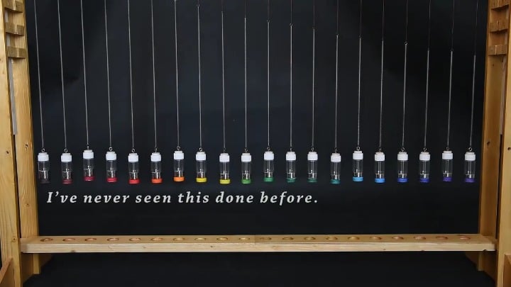 A mercury pendulum wave: 20 little bottles containing slightly different masses of mercury so the oscillating frequency is slightly different