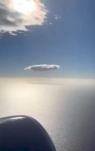 A single cloud wandering through the endless sky