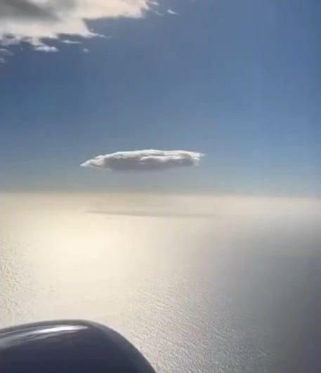 A single cloud wandering through the endless sky