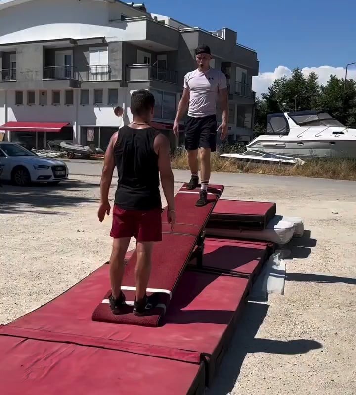 Acrobatics on a teeterboard