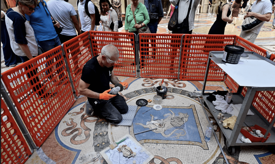 Artisan restoring bull mosaic’s testicles worn down by pirouetting tourists in Italy