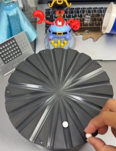 The effect created by these rolling balls