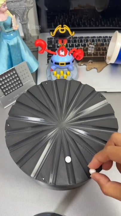 The effect created by these rolling balls