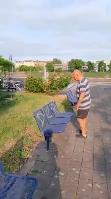 This old man doing a flawless front hand spring over a bus stop bench